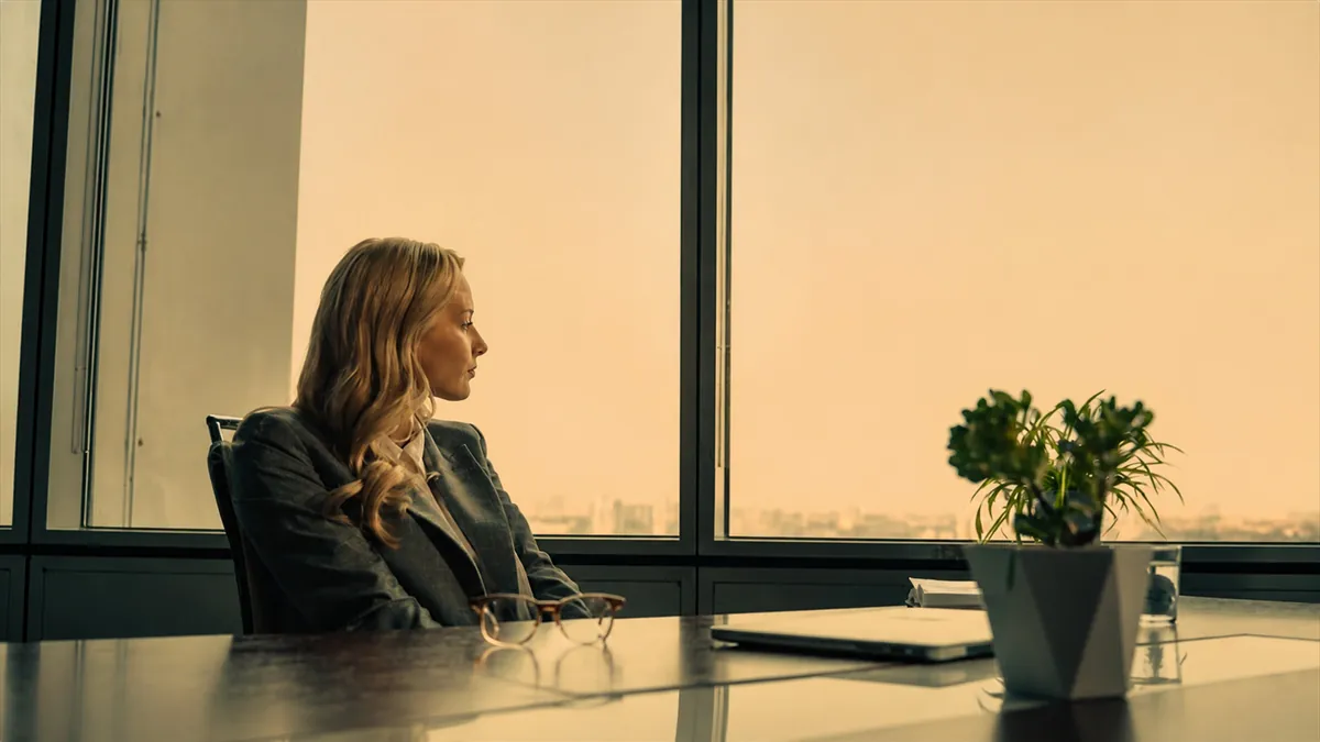 Businesswoman sitting alone in office