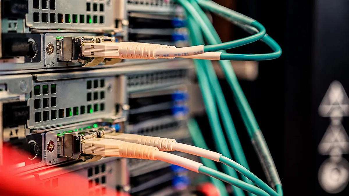 Network cables connected to server rack