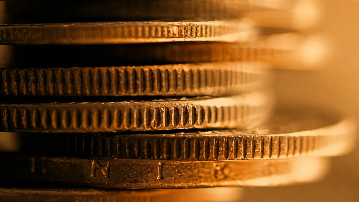 Stacked gold coins close up
